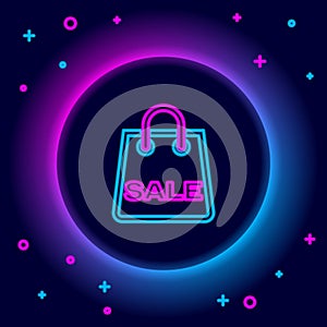 Glowing neon line Shopping bag with an inscription Sale icon isolated on black background. Handbag sign. Woman bag icon