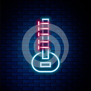 Glowing neon line Sitar classical music instrument icon isolated on brick wall background. Colorful outline concept