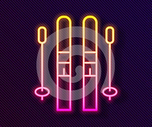 Glowing neon line Ski and sticks icon isolated on black background. Extreme sport. Skiing equipment. Winter sports icon. Vector