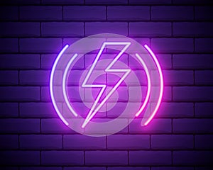 Glowing neon line Smartphone charging on wireless charger icon isolated on brick wall background. Charging battery on