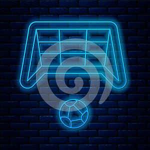 Glowing neon line Soccer goal with ball icon isolated on brick wall background. Vector