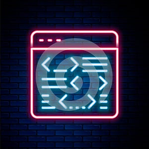 Glowing neon line Software, web developer programming code icon isolated on brick wall background. Javascript computer