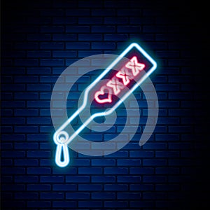 Glowing neon line Spanking paddle icon isolated on brick wall background. Fetish accessory. Sex toy for adult. Colorful