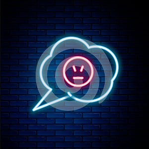 Glowing neon line Speech bubble with angry smile icon isolated on brick wall background. Emoticon face. Colorful outline