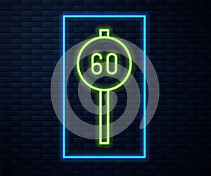 Glowing neon line Speed limit traffic sign 60 km icon isolated on brick wall background. Vector