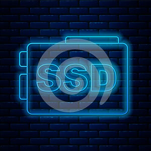 Glowing neon line SSD card icon isolated on brick wall background. Solid state drive sign. Storage disk symbol. Vector