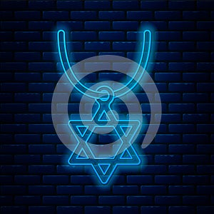 Glowing neon line Star of David necklace on chain icon isolated on brick wall background. Jewish religion symbol. Symbol