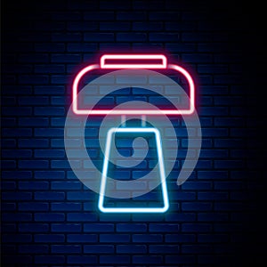 Glowing neon line Table lamp icon isolated on brick wall background. Desk lamp. Colorful outline concept. Vector