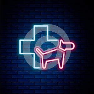 Glowing neon line Veterinary clinic symbol icon isolated on brick wall background. Cross with dog veterinary care. Pet