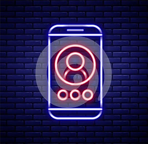 Glowing neon line Video chat conference icon isolated on brick wall background. Online meeting work form home. Remote