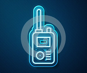 Glowing neon line Walkie talkie icon isolated on blue background. Portable radio transmitter icon. Radio transceiver