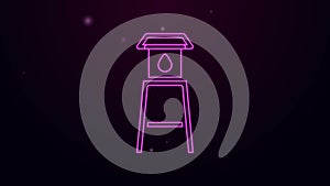 Glowing neon line Water tower icon isolated on black background. 4K Video motion graphic animation