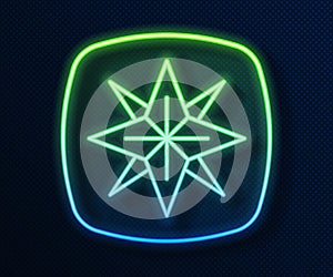 Glowing neon line Wind rose icon isolated on blue background. Compass icon for travel. Navigation design. Vector