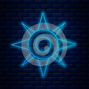 Glowing neon line Wind rose icon isolated on brick wall background. Compass icon for travel. Navigation design. Vector