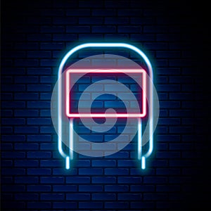 Glowing neon line Winter hat with ear flaps icon isolated on brick wall background. Colorful outline concept. Vector