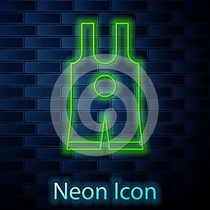 Glowing neon line Wrestling singlet icon isolated on brick wall background. Wrestling tricot. Vector