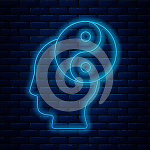 Glowing neon line Yin Yang symbol of harmony and balance icon isolated on brick wall background. Vector