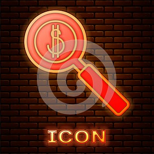 Glowing neon Magnifying glass and dollar symbol icon isolated on brick wall background. Find money. Looking for money