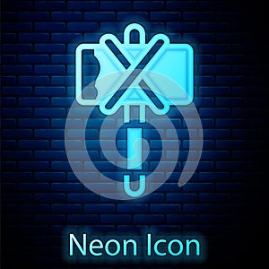 Glowing neon Medieval axe icon isolated on brick wall background. Battle axe, executioner axe. Medieval weapon. Vector