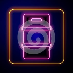 Glowing neon Metal beer keg icon isolated on black background. Vector