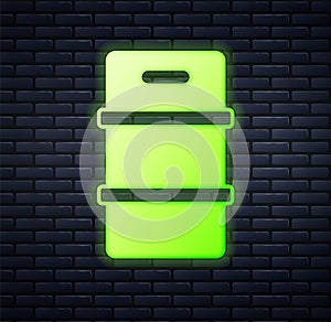 Glowing neon Metal beer keg icon isolated on brick wall background. Vector