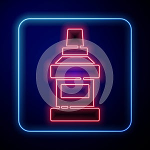 Glowing neon Mouthwash plastic bottle icon isolated on blue background. Liquid for rinsing mouth. Oralcare equipment