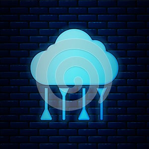 Glowing neon Network cloud connection icon isolated on brick wall background. Social technology. Cloud computing concept