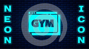 Glowing neon Online fitness and training icon isolated on brick wall background. Vector