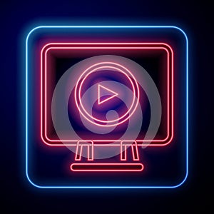 Glowing neon Online play video icon isolated on black background. Film strip with play sign. Vector