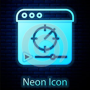 Glowing neon Online play video icon isolated on brick wall background. Film strip with play sign. Vector