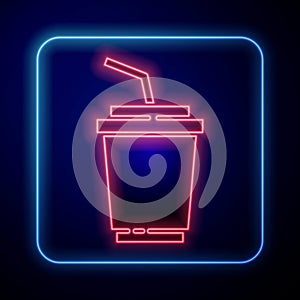 Glowing neon Paper glass with drinking straw and water icon isolated on blue background. Soda drink glass. Fresh cold