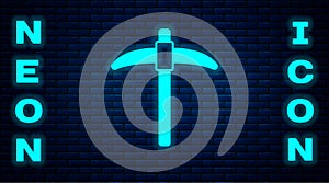 Glowing neon Pickaxe icon isolated on brick wall background. Vector