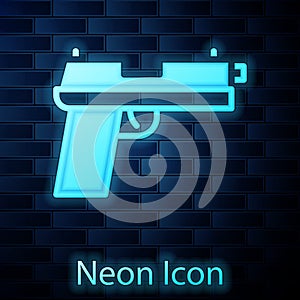 Glowing neon Pistol or gun icon isolated on brick wall background. Police or military handgun. Small firearm. Vector