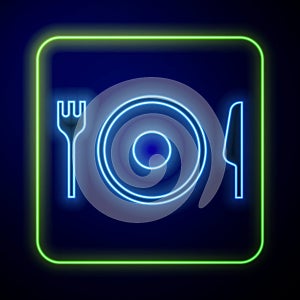 Glowing neon Plate, fork and knife icon isolated on blue background. Cutlery symbol. Restaurant sign. Vector