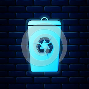 Glowing neon Recycle bin with recycle symbol icon isolated on brick wall background. Trash can icon. Garbage bin sign