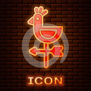 Glowing neon Rooster weather vane icon isolated on brick wall background. Weathercock sign. Windvane rooster. Vector