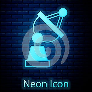 Glowing neon Satellite dish icon isolated on brick wall background. Radio antenna, astronomy and space research. Vector