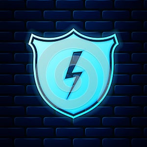 Glowing neon Secure shield with lightning icon isolated on brick wall background. Security, safety, protection, privacy