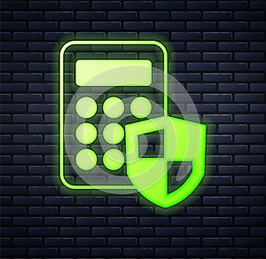Glowing neon Security system control panel with display icon isolated on brick wall background. Keypad of security