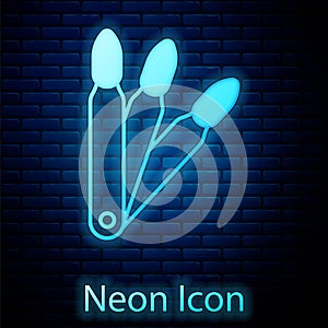 Glowing neon Set of false nails for manicure icon isolated on brick wall background. Varnish color palette for nail