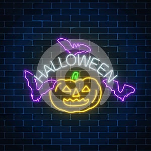 Glowing neon sign of halloween banner design with pumpkin and bats. Bright halloween night scary sign neon style.