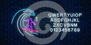 Glowing neon sign of surfer in ocean wave with alphabet. Man on surfboard on waves. Symbol of summer leisure