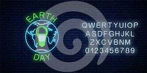 Glowing neon sign of world earth day with globe symbol and green led light bulb with alphabet. Earth day neon banner
