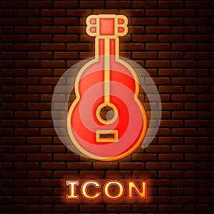 Glowing neon Spanish guitar icon isolated on brick wall background. Acoustic guitar. String musical instrument. Vector