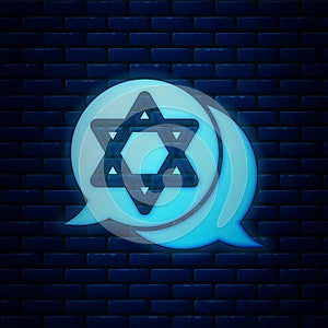 Glowing neon Star of David icon isolated on brick wall background. Jewish religion symbol. Symbol of Israel. Vector