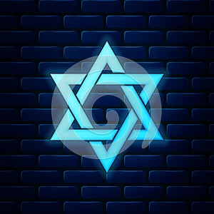 Glowing neon Star of David icon isolated on brick wall background. Jewish religion symbol. Vector