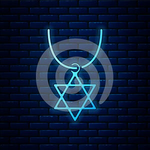 Glowing neon Star of David necklace on chain icon isolated on brick wall background. Jewish religion symbol. Symbol of