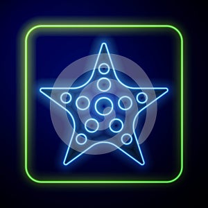 Glowing neon Starfish icon isolated on blue background. Vector