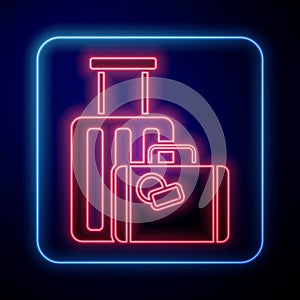 Glowing neon Suitcase for travel icon isolated on blue background. Traveling baggage sign. Travel luggage icon. Vector
