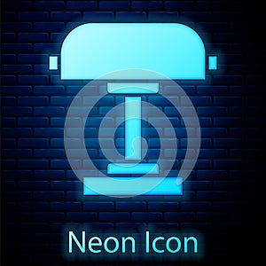 Glowing neon Table lamp icon isolated on brick wall background. Desk lamp. Vector